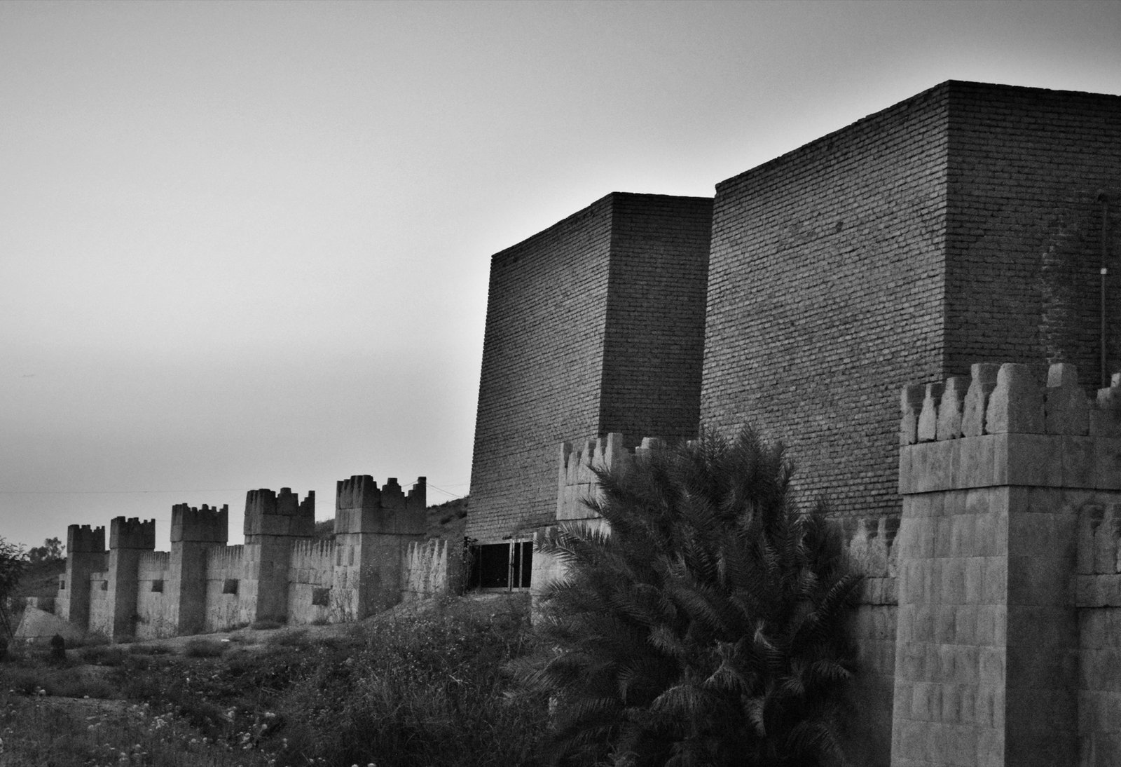 The reconstructed Mashki Gate and surviving wall remains at ancient Nineveh, near modern Mosul.